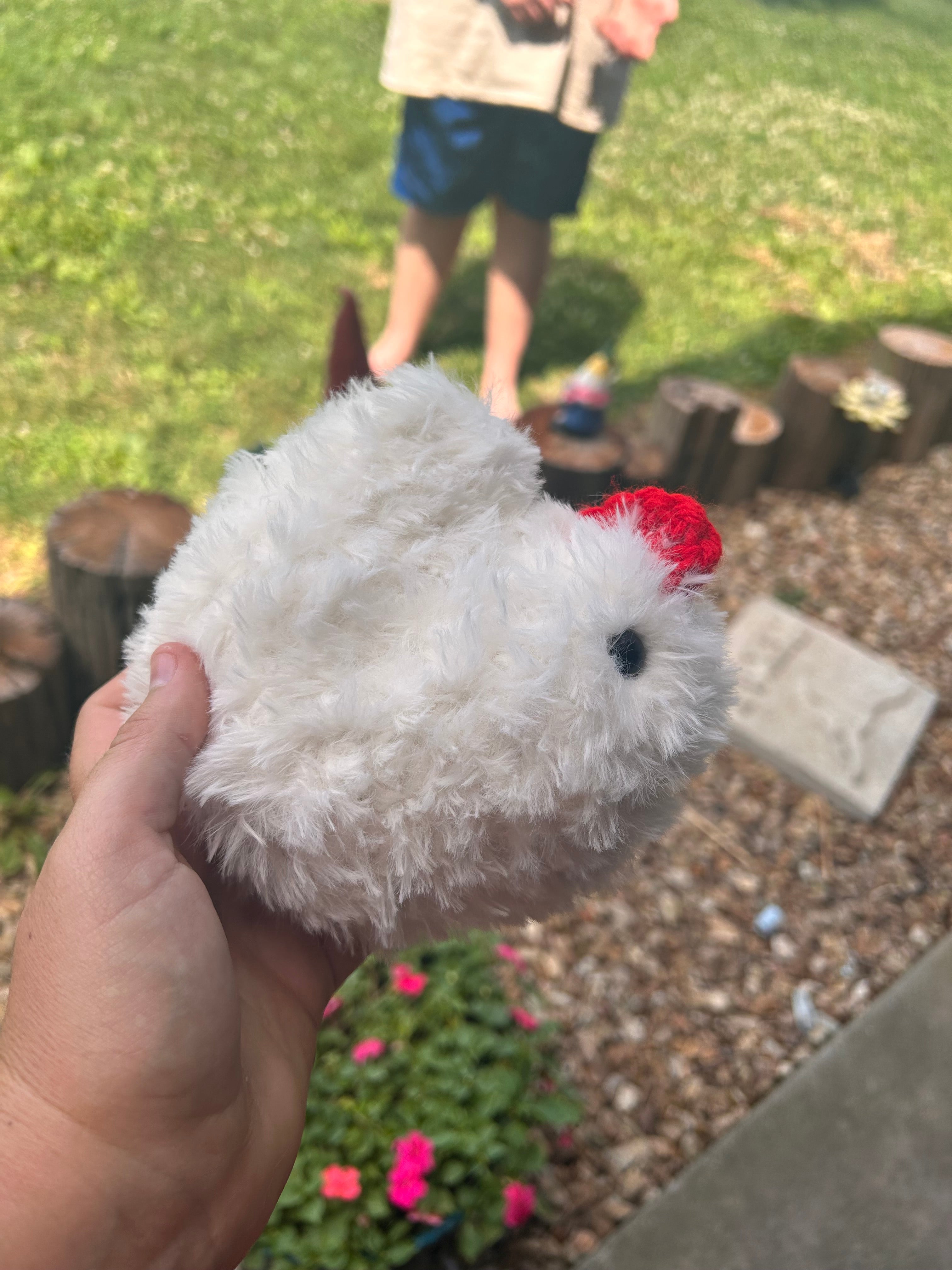 Hand crochets fluffy chicken