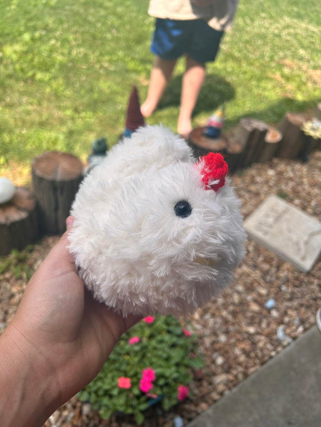 Hand crochets fluffy chicken