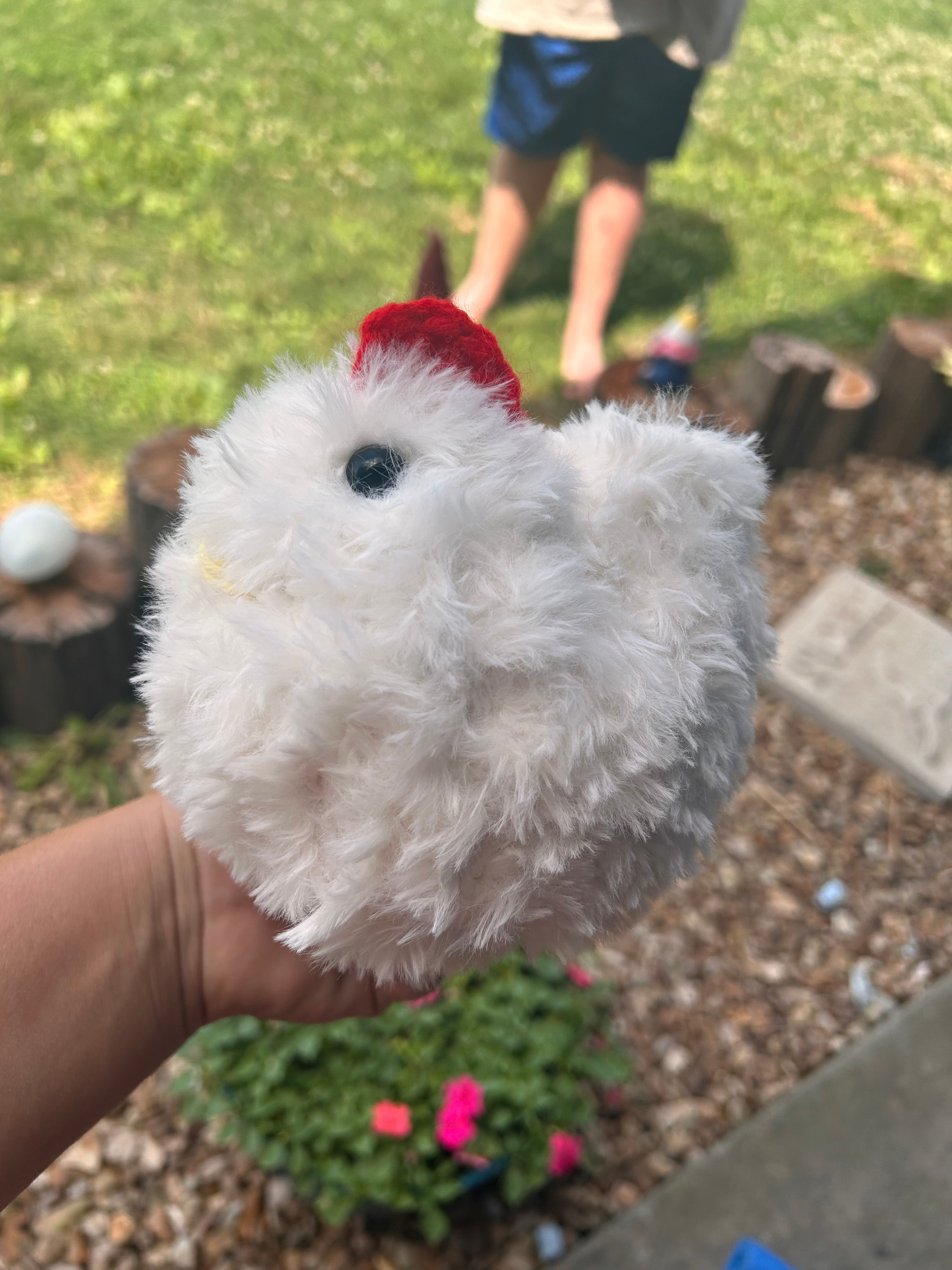 Hand crochets fluffy chicken